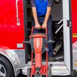 man unloading equipment from truck