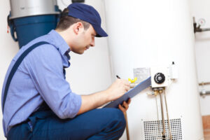 Technician repairing an hot-water heater